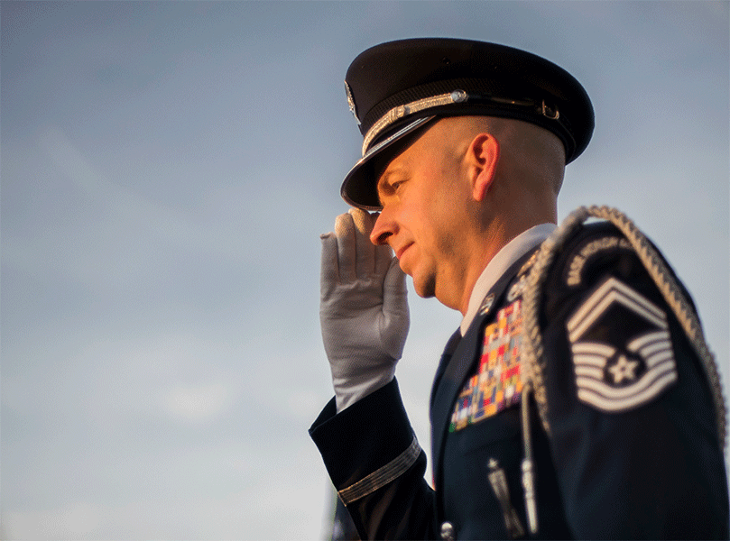 An Honor Guard member renders a salute.