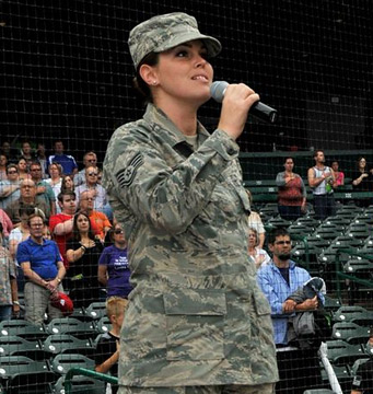 An Airman sings the national anthem.